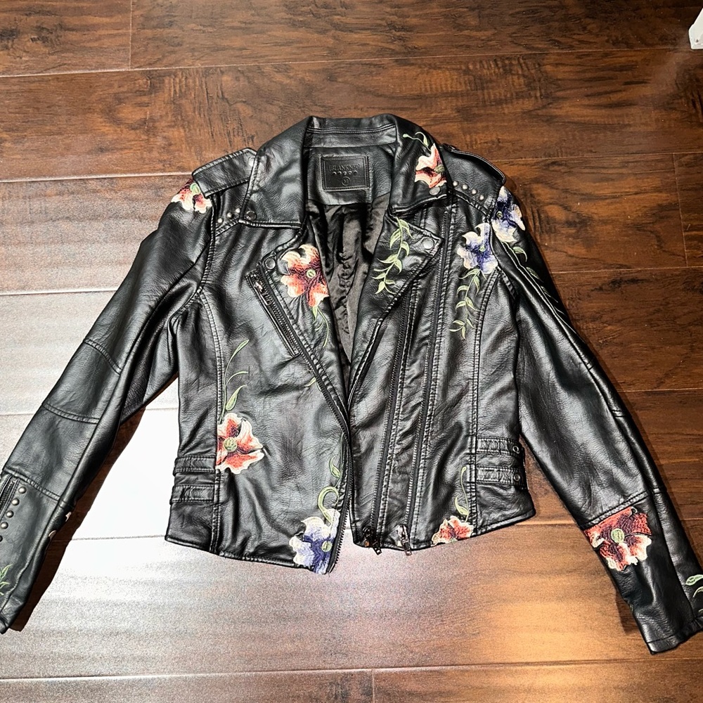 Black leather jacket with flowers